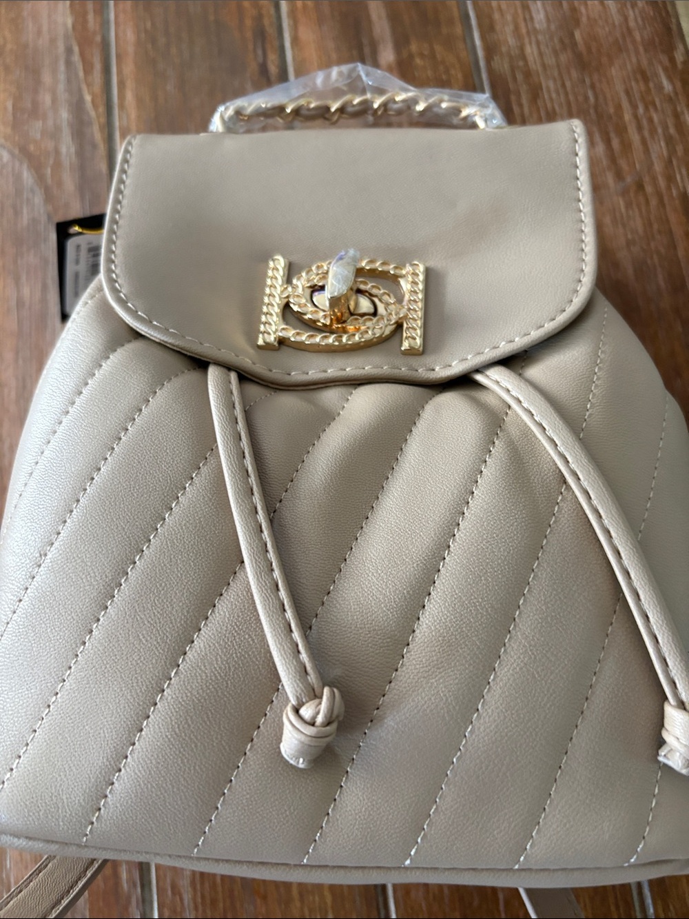 bebe Quilted Cream Drawstring Backpack with Gold-Tone Accent